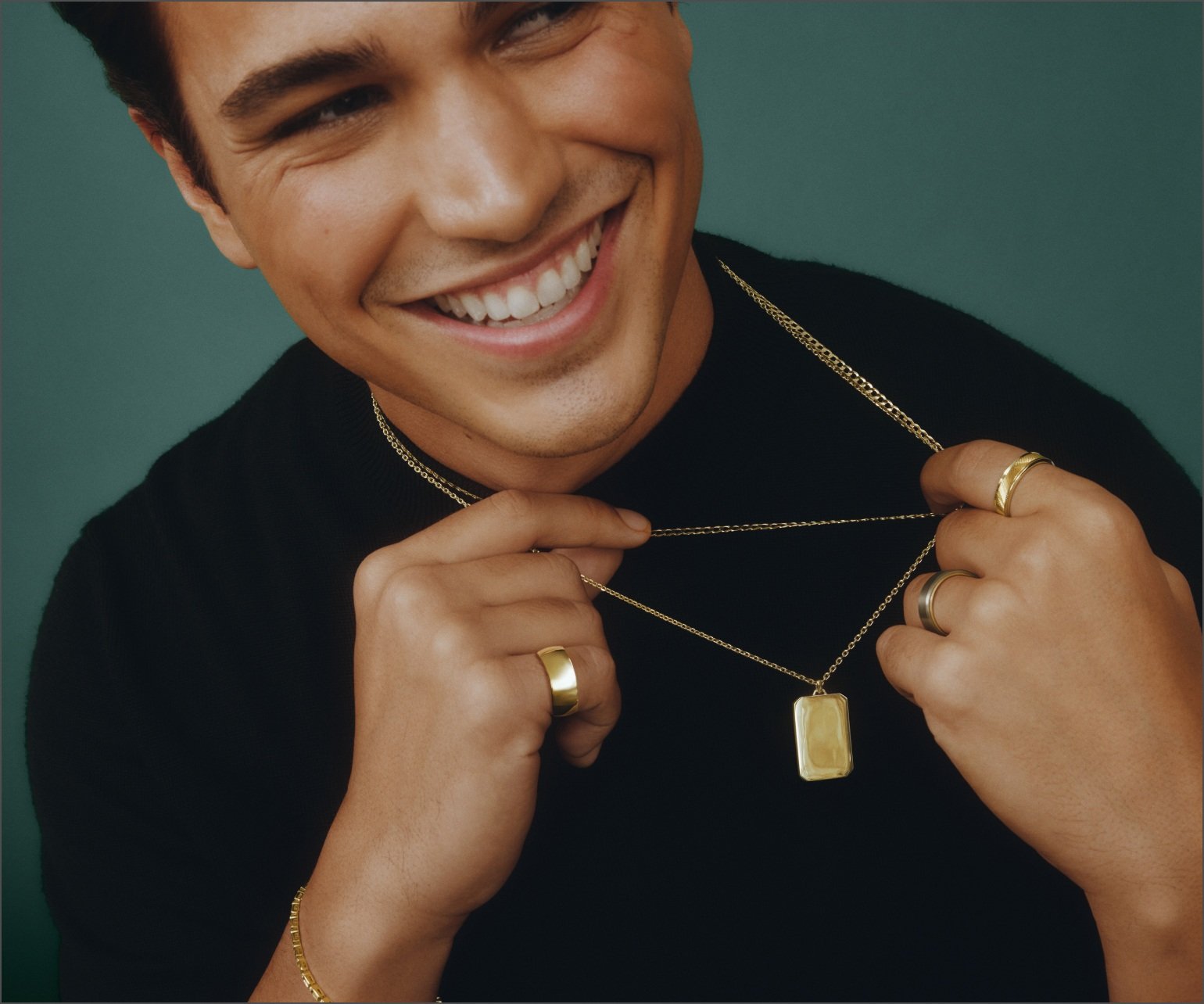 Male model wearing yellow gold men's fine jewelry.