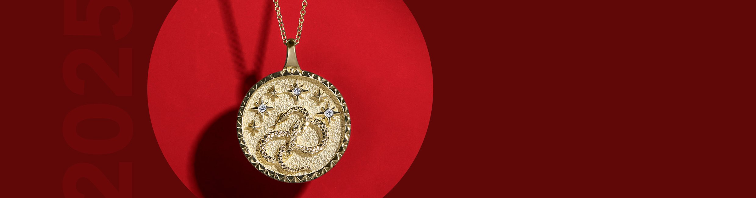 Yellow gold snake medallion necklace