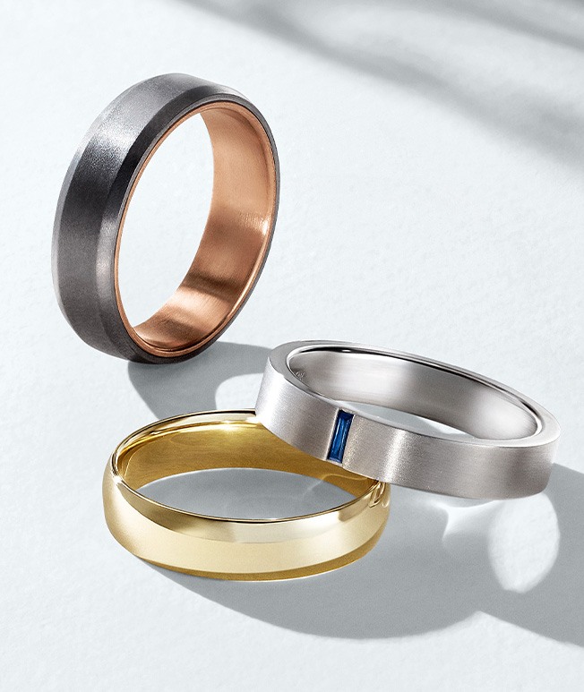 Men's gold, gemstone, and alternative metal wedding bands.