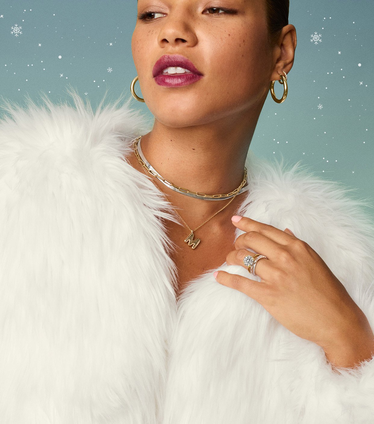 Model wearing chain necklaces and personalized pendant.