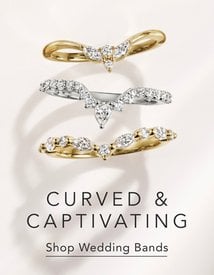 Curved, diamond women's wedding rings.