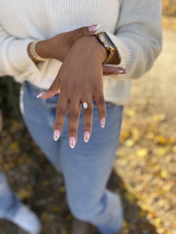 Oval diamond ring on hand