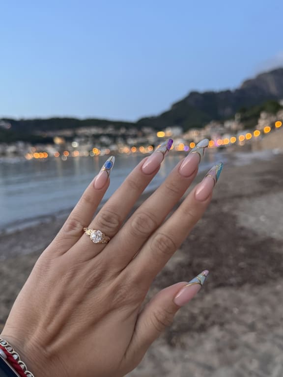 Oval diamond ring on hand