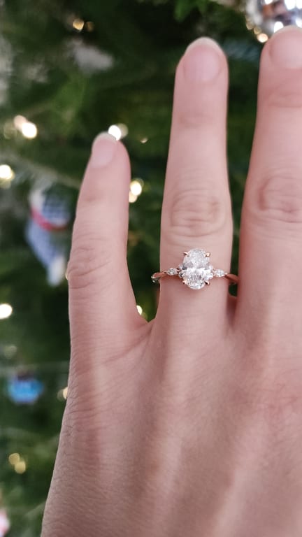 Oval diamond ring on hand