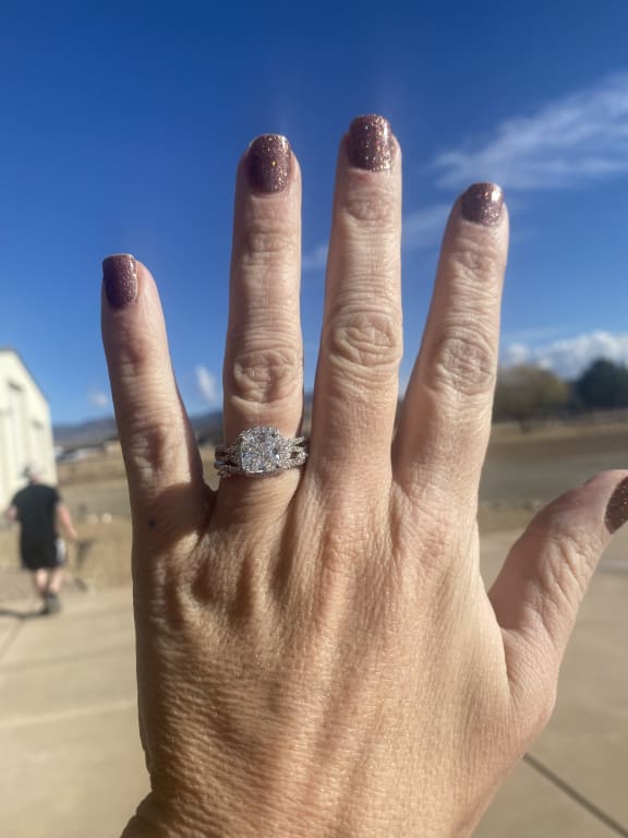 Oval diamond ring on hand