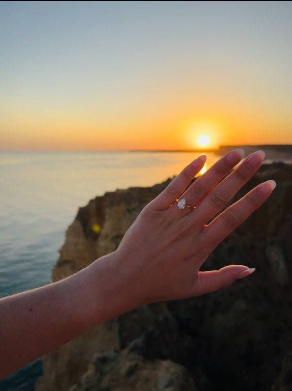 Oval diamond ring on hand