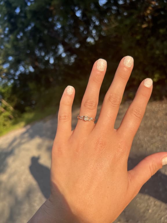 Oval diamond ring on hand