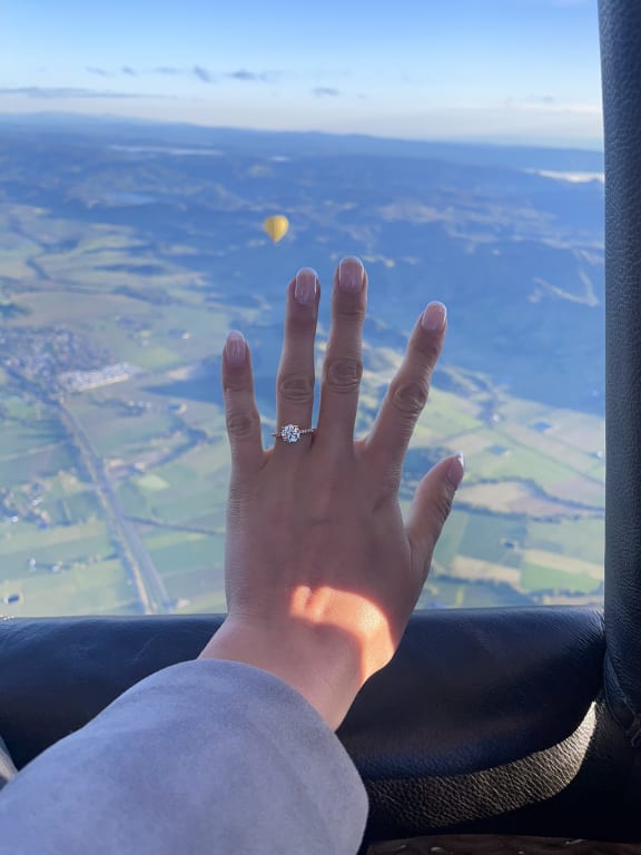 Oval diamond ring on hand