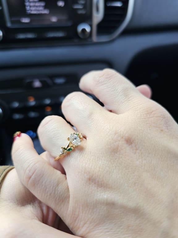 Oval diamond ring on hand