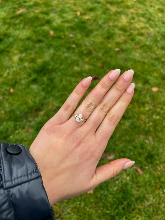 Oval diamond ring on hand