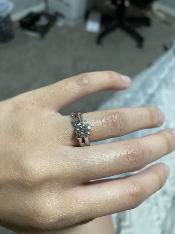 Oval diamond ring on hand