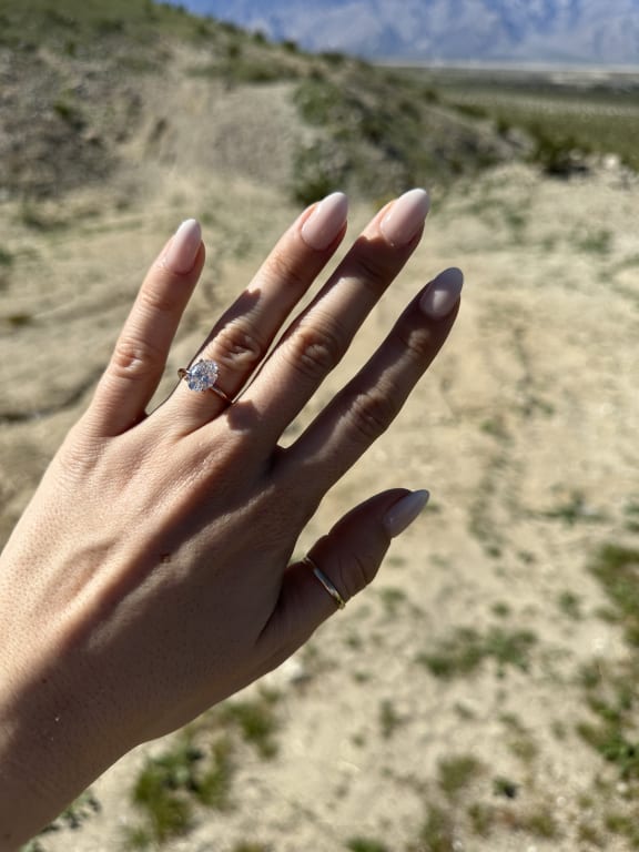 Oval diamond ring on hand