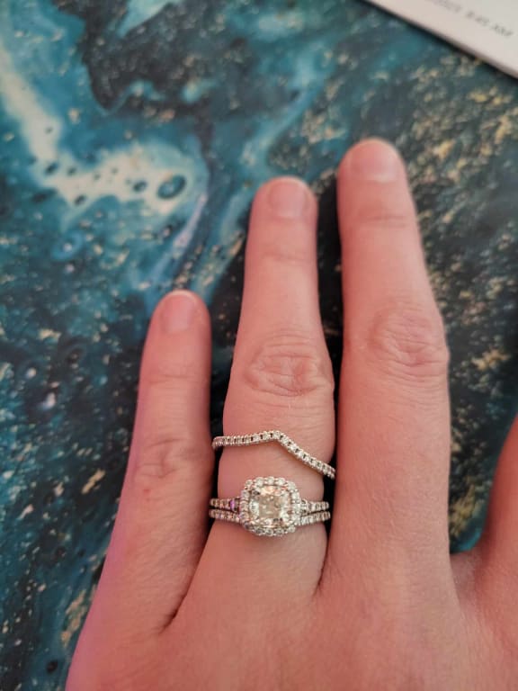 Oval diamond ring on hand