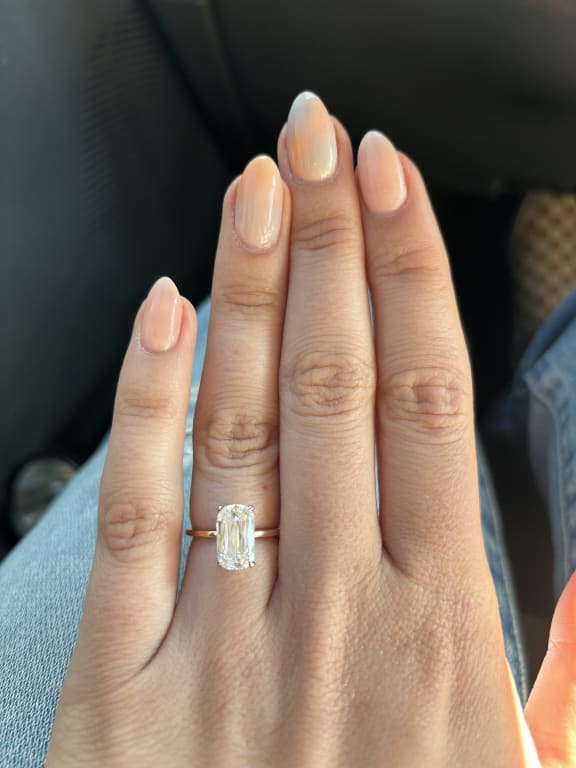 Oval diamond ring on hand