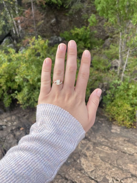 Oval diamond ring on hand