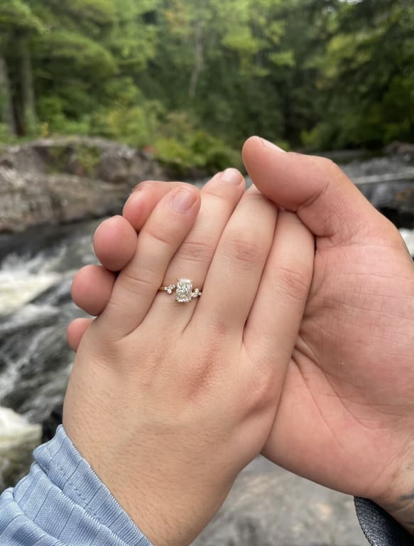 Oval diamond ring on hand