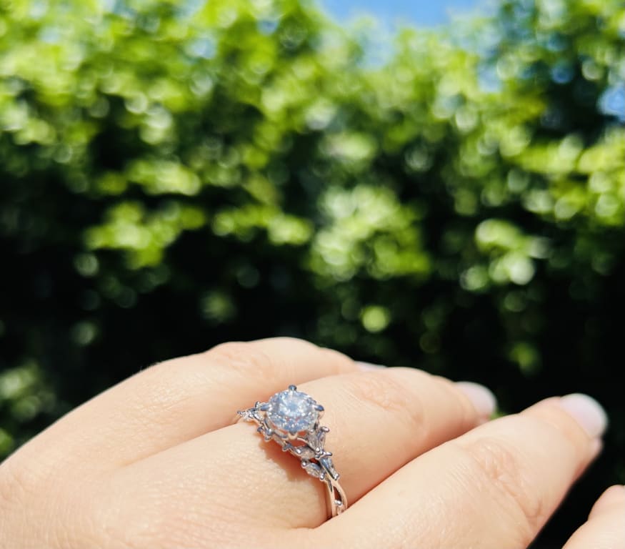 Oval diamond ring on hand