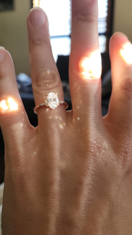 Oval diamond ring on hand