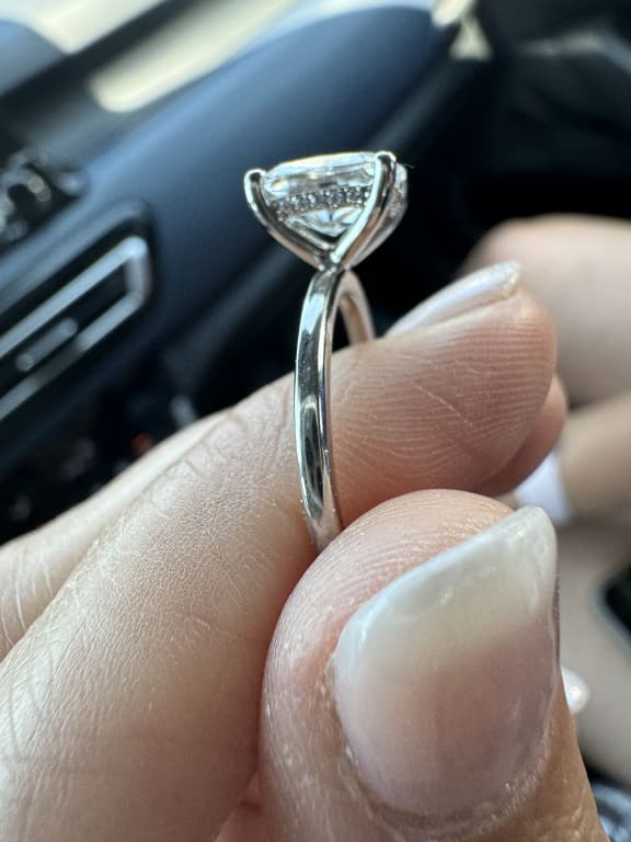 Oval diamond ring on hand