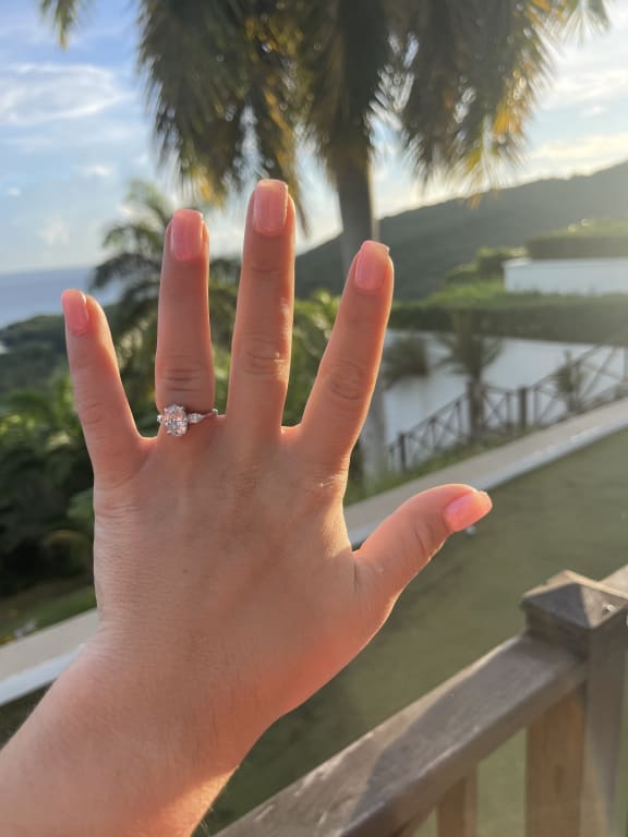 Oval diamond ring on hand