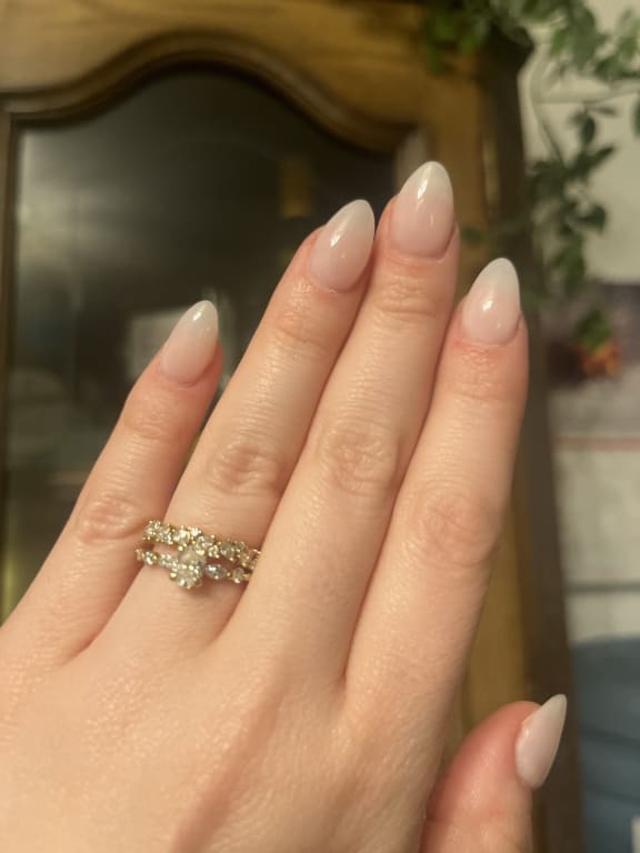 Oval diamond ring on hand