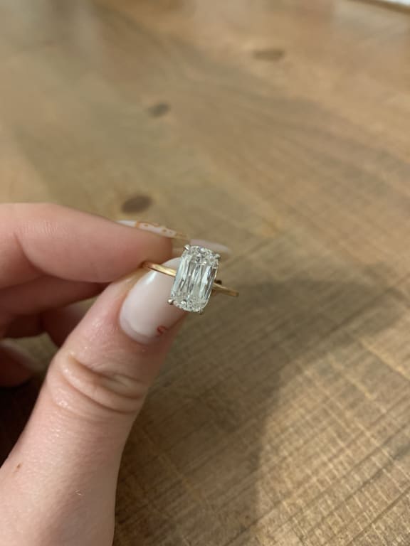 Oval diamond ring on hand