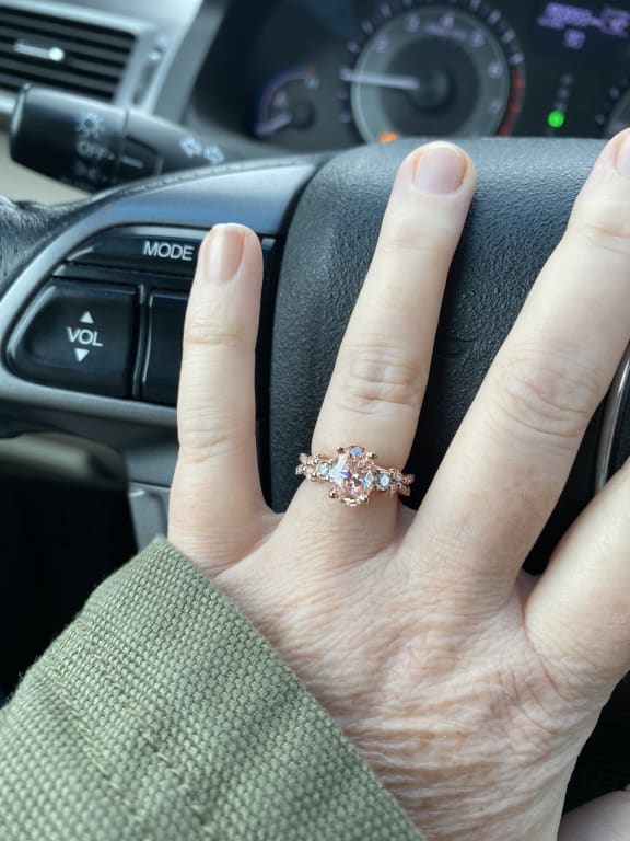 Oval diamond ring on hand