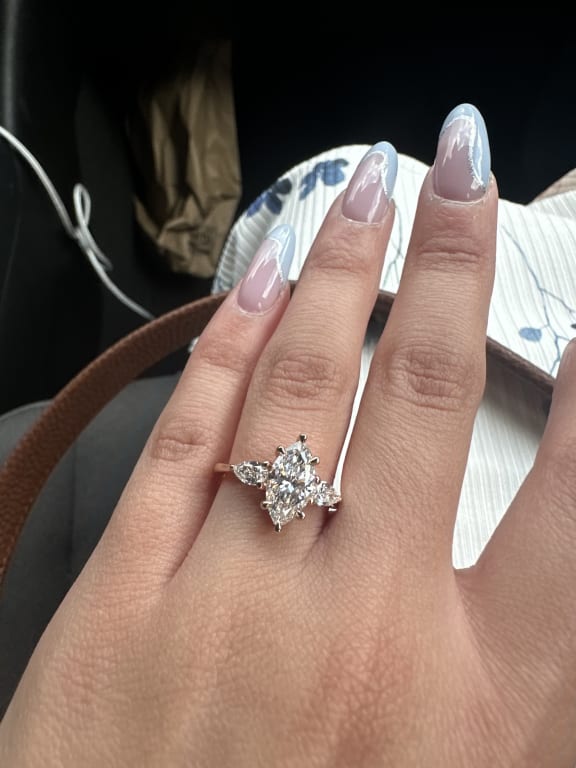 Oval diamond ring on hand