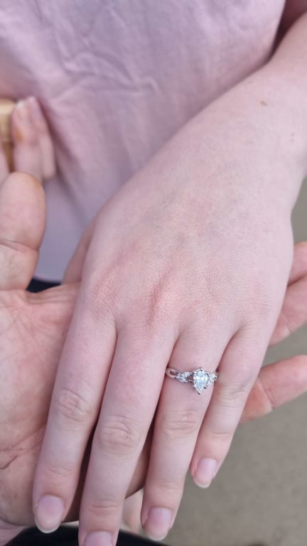 Oval diamond ring on hand