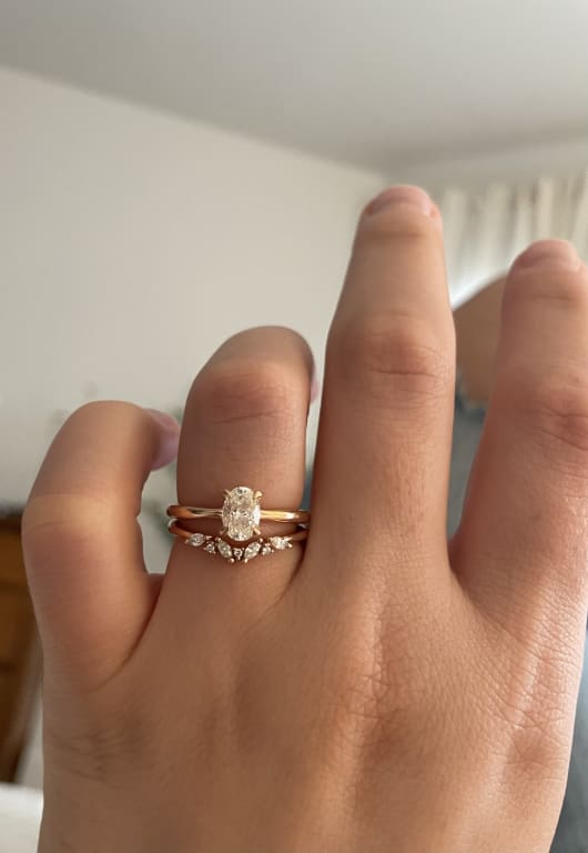 Oval diamond ring on hand