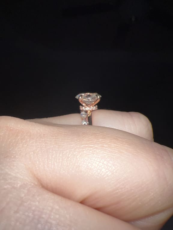 Oval diamond ring on hand