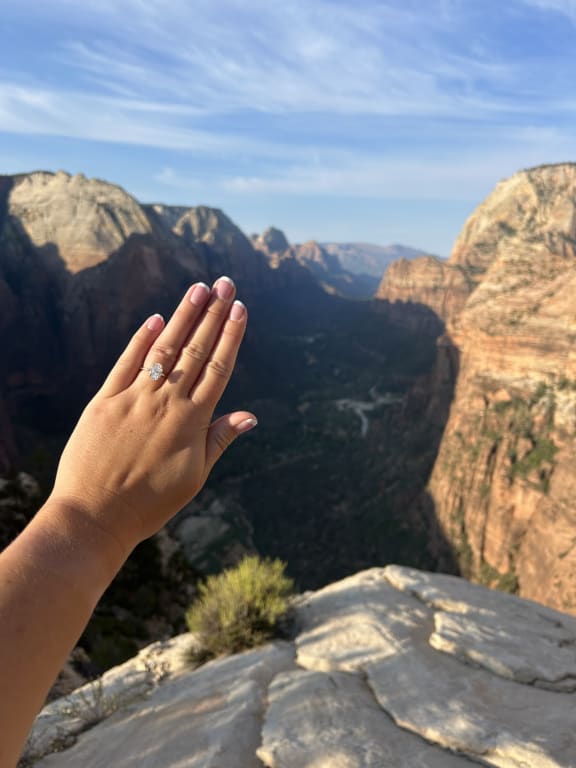 Oval diamond ring on hand