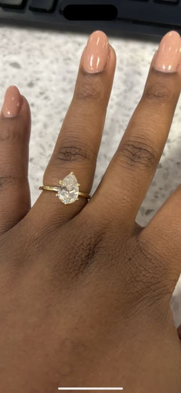 Oval diamond ring on hand