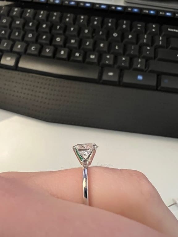 Oval diamond ring on hand