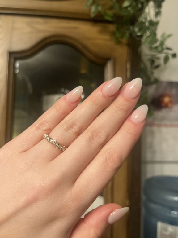 Oval diamond ring on hand