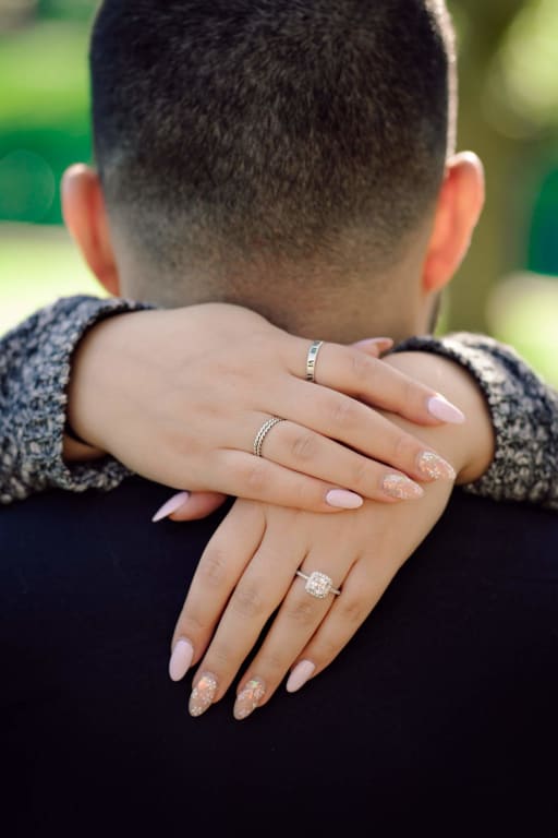 Oval diamond ring on hand