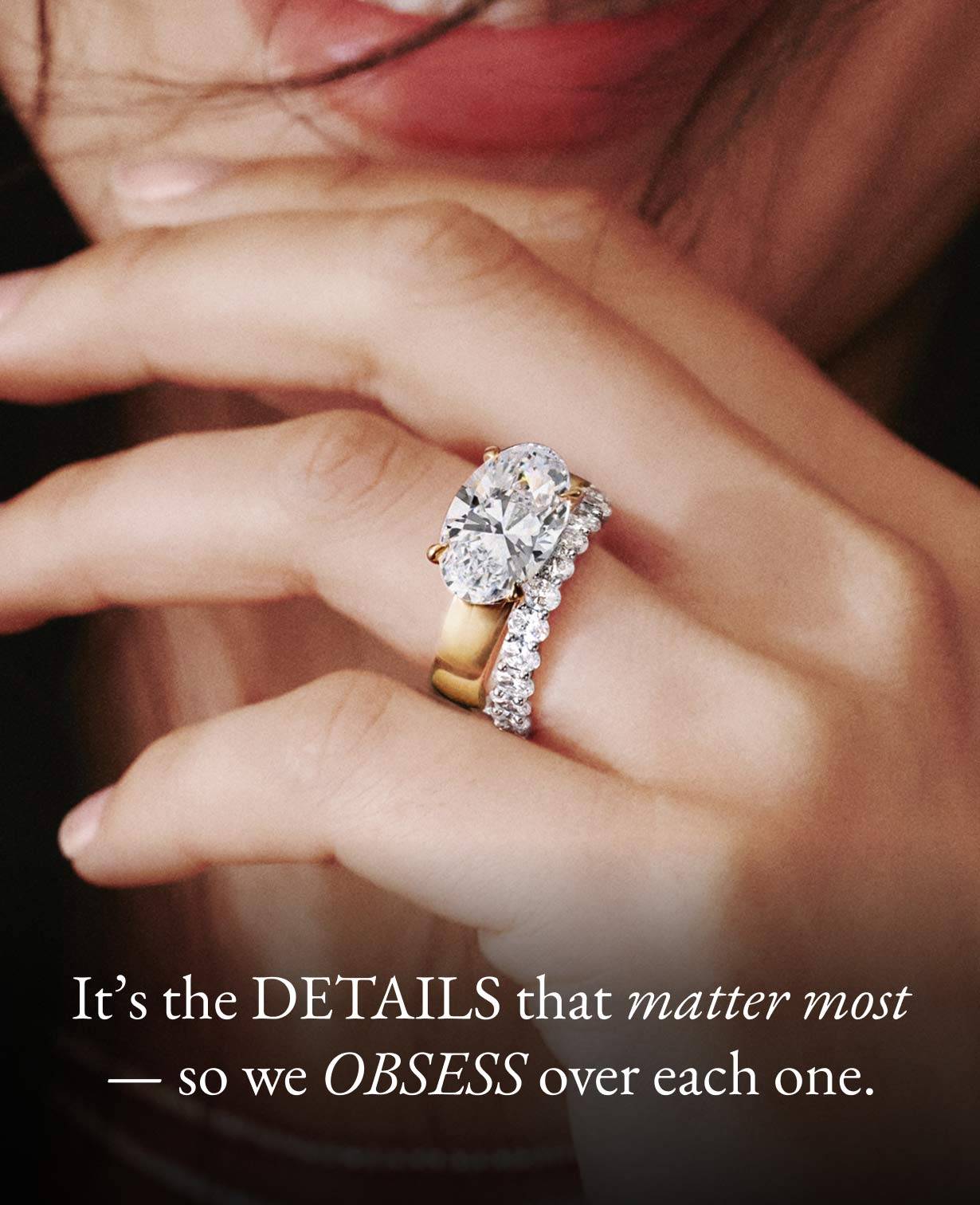 Model wearing diamond engagement ring and gold necklace from the Jane Goodall collection