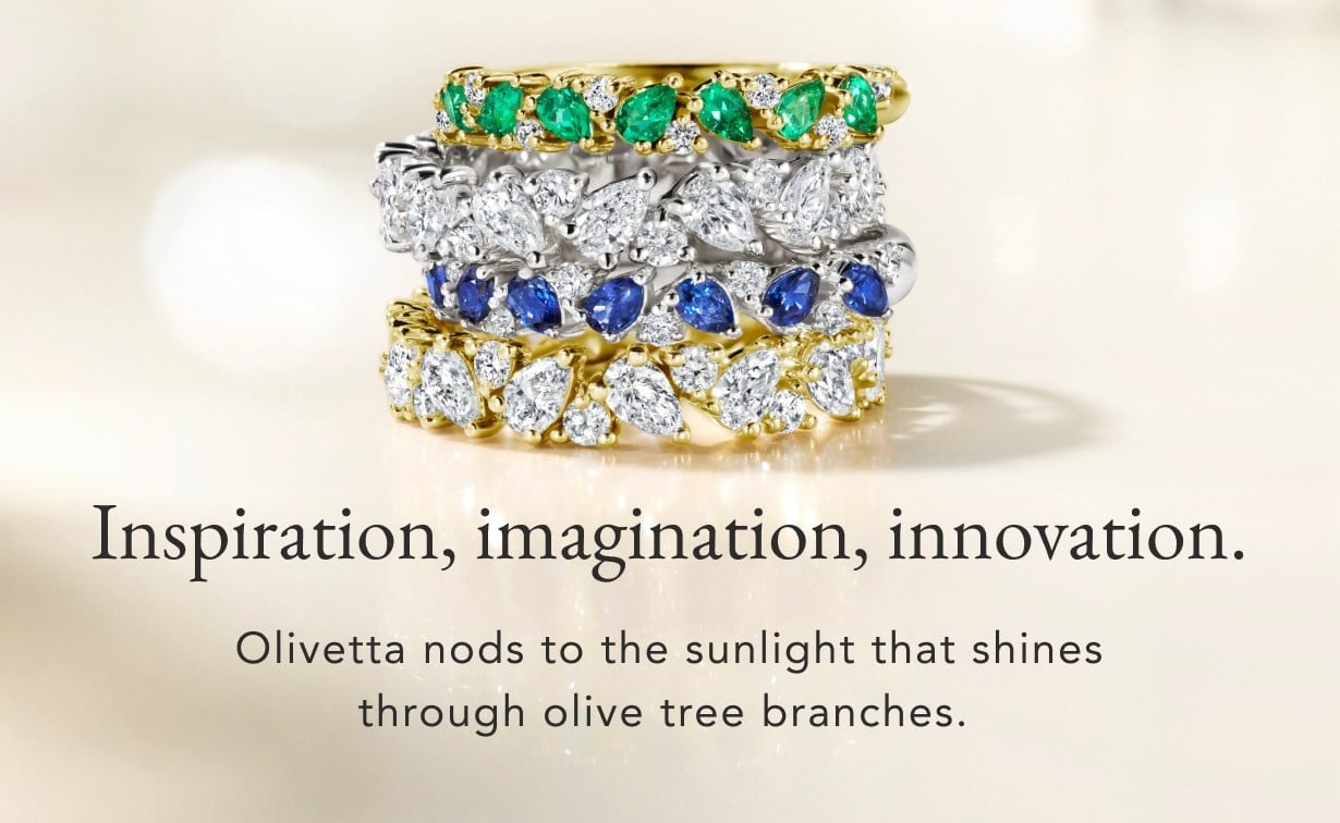 Stack of diamond and gemstone wedding rings featured from The Olivetta Signature Bridal Collection.
