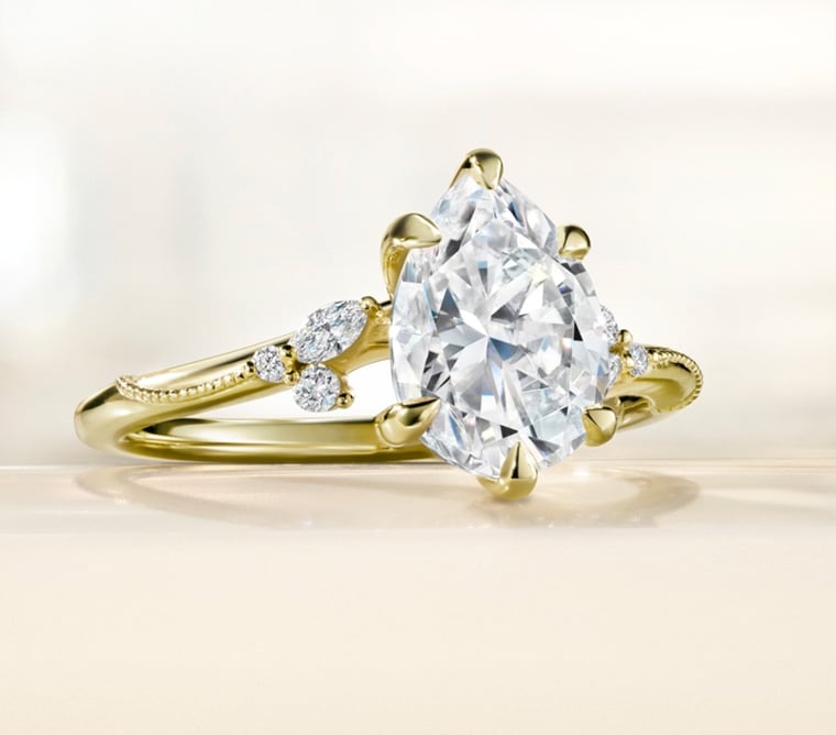 Gold diamond engagement ring from the Camellia signature bridal collection
