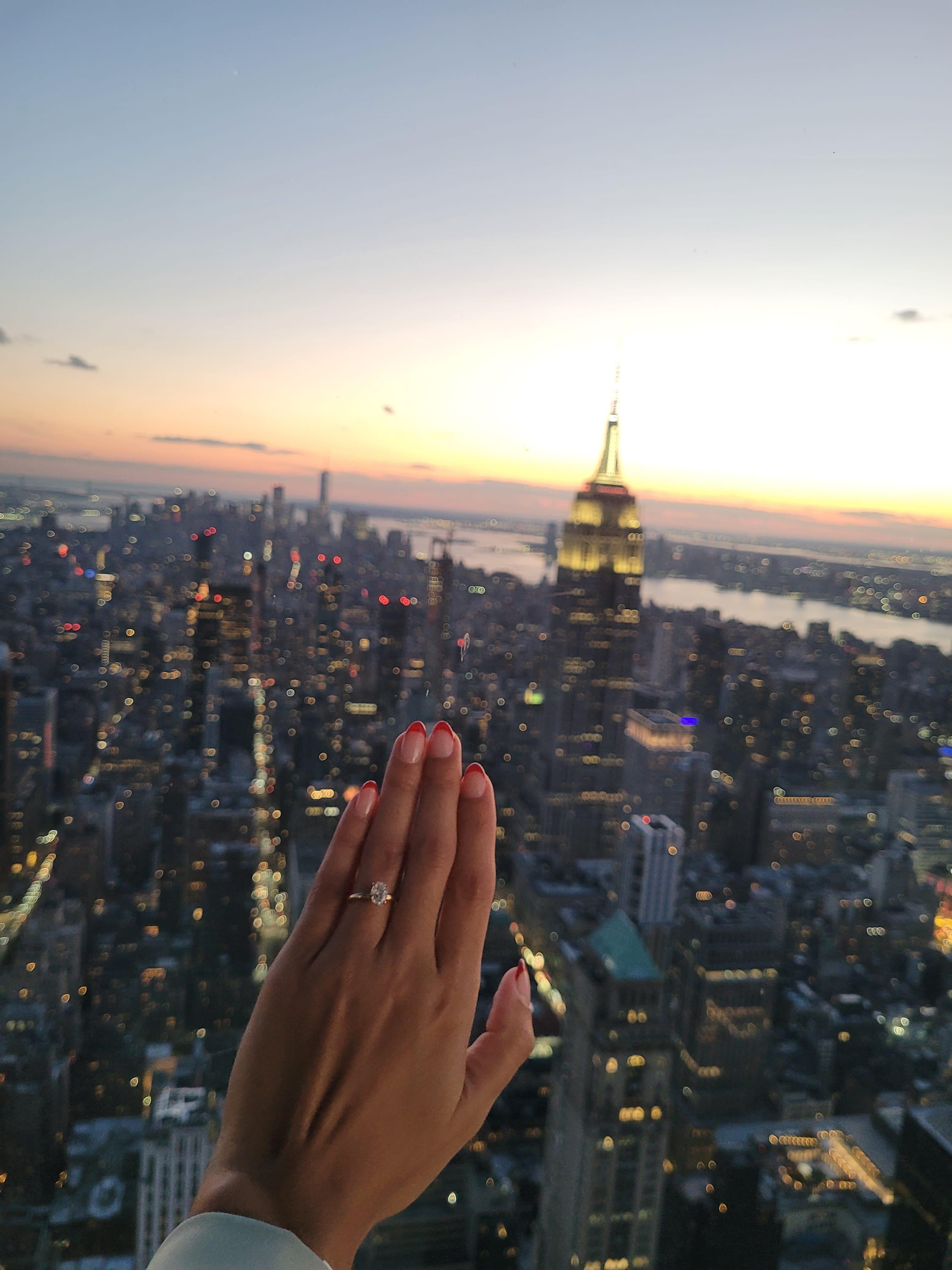 Oval diamond ring on hand