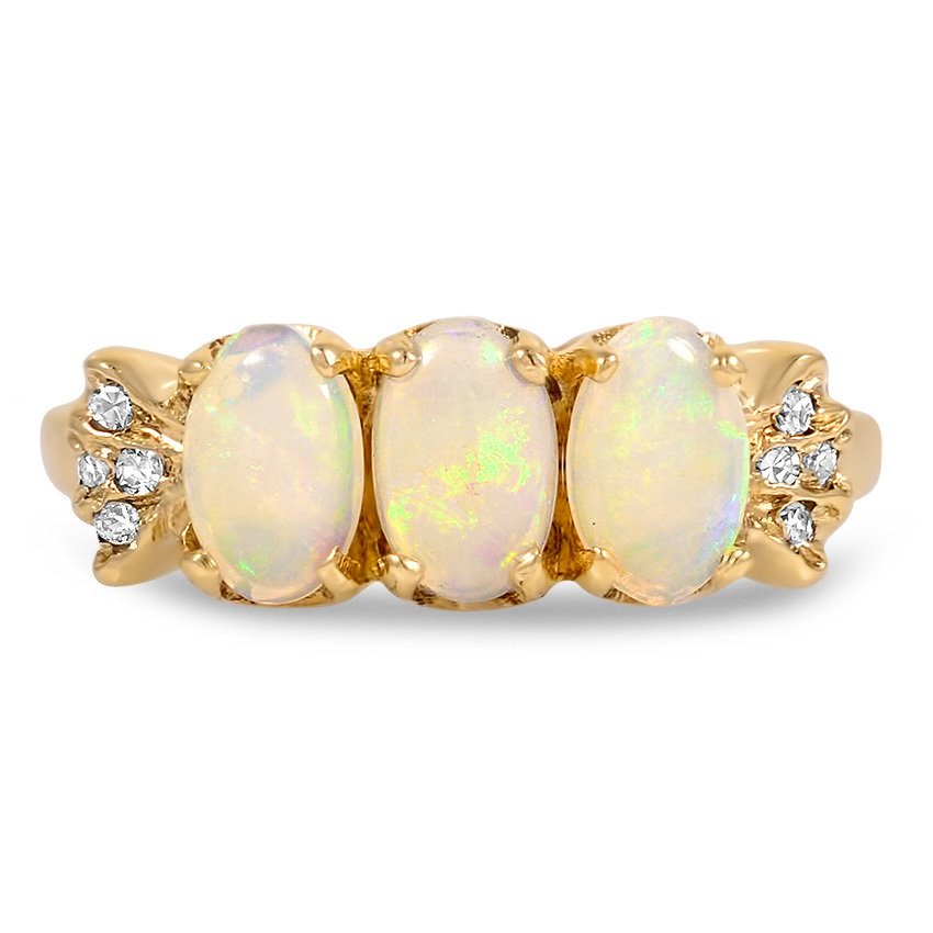 Three Iridescent Milky Opals Captivate In Their Yellow Gold Setting 