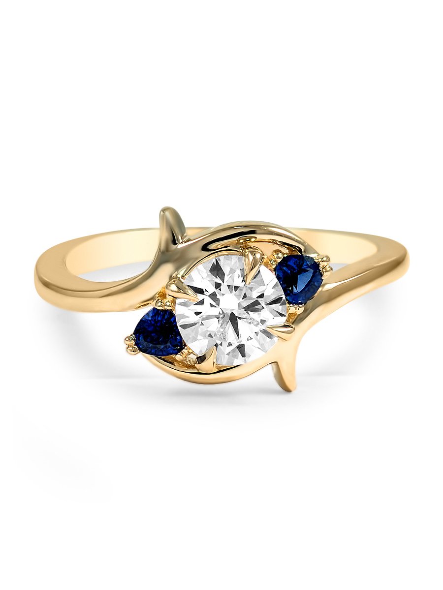 sweeping-thre-stone-sapphire-and-diamond-ring-resize-1.jpg