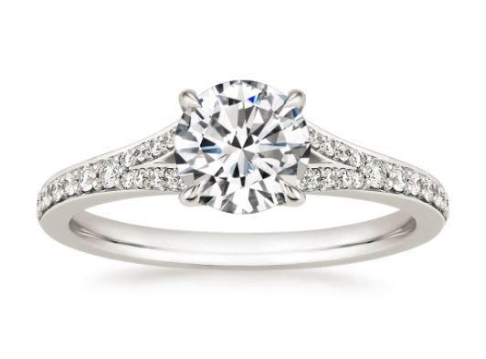 This diamond embellished band parts at the shoulder to embrace and ...