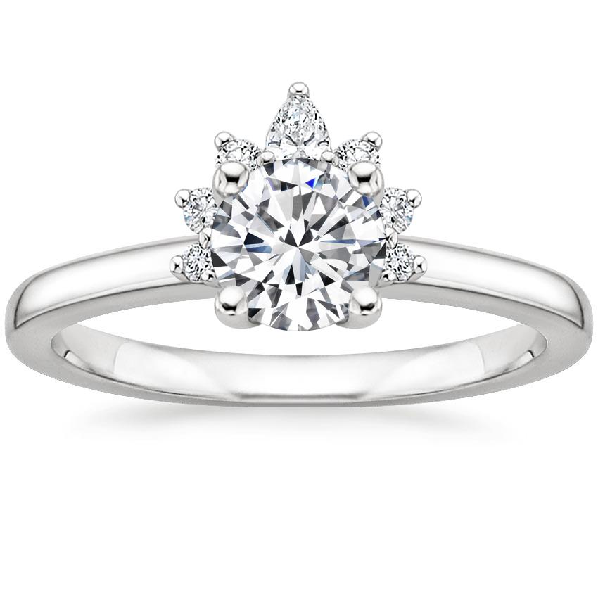 Sparkling pear and round brilliant cut diamonds adorn this modern ...