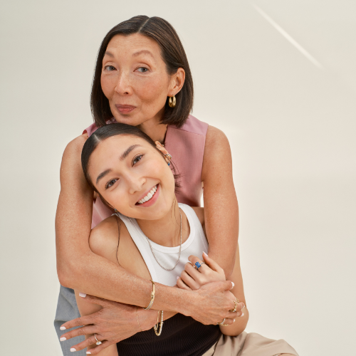 Mother and daughter wearing ethically-sourced fine jewelry. 