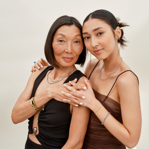 Mother and daughter wearing ethically-sourced fine jewelry. 