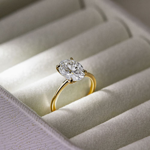 yellow gold solitaire ring in ringbox