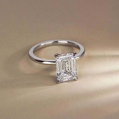 solitaire engagement ring with emerald cut diamond center stone