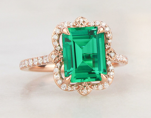Rose gold emerald engagement ring.