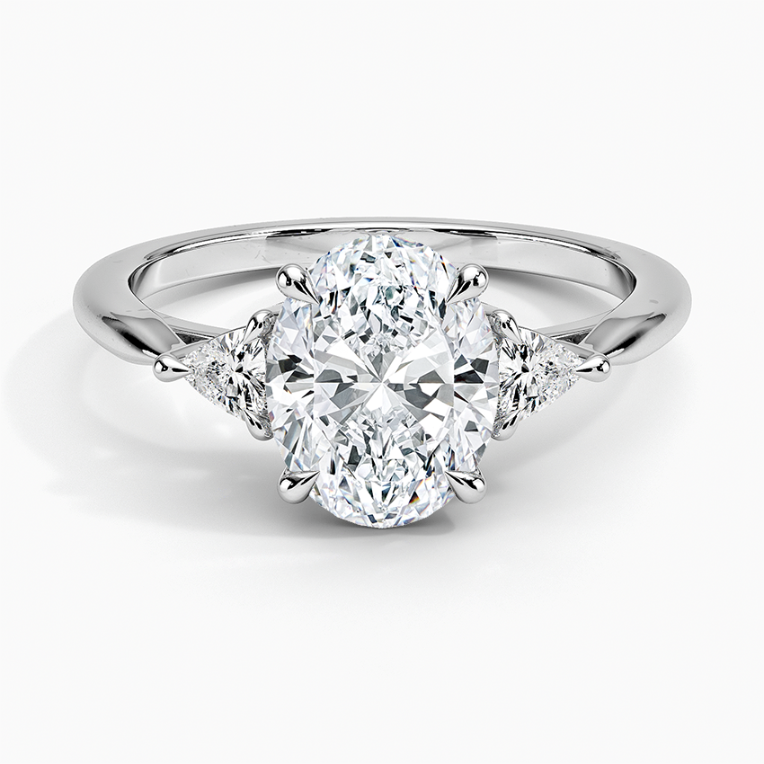 Oval engagement ring with online trillion side stones